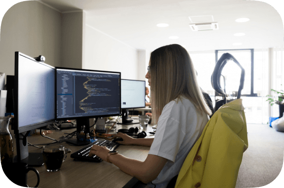 Ivinco staff member working in front of a computer